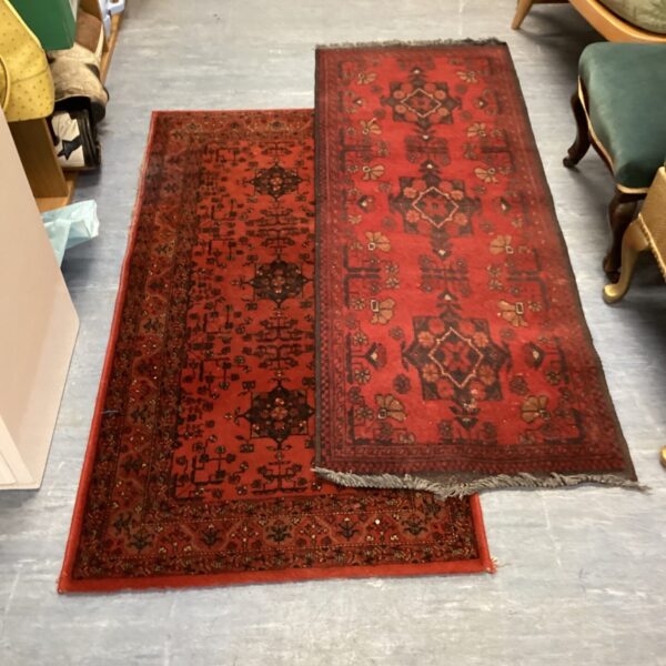 Pair of vintage red runner rugs with Oriental patterns.