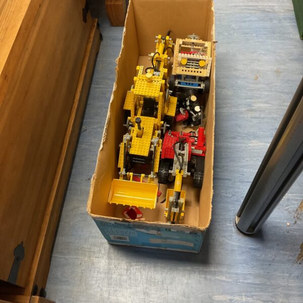 Box of vintage Lego Technic parts for building and collecting.