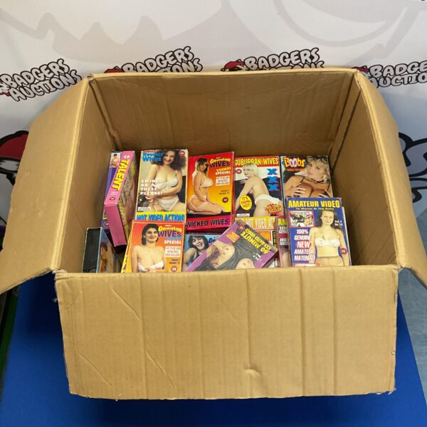 Mixed lot of vintage VHS adult films for collectors.