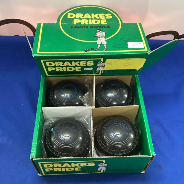 Vintage Drake Pride lawn bowls set for outdoor games.