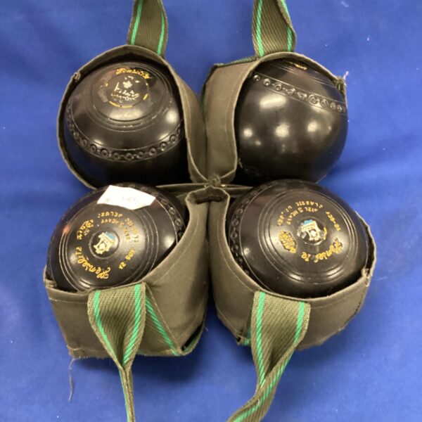 Vintage Hemselite lawn bowls set for outdoor garden games.