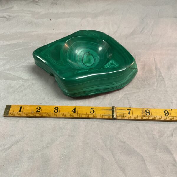 Vibrant green malachite trinket dish with natural stone patterns.