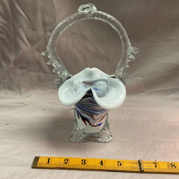 Vintage Murano glass basket vase with blue and white swirls.