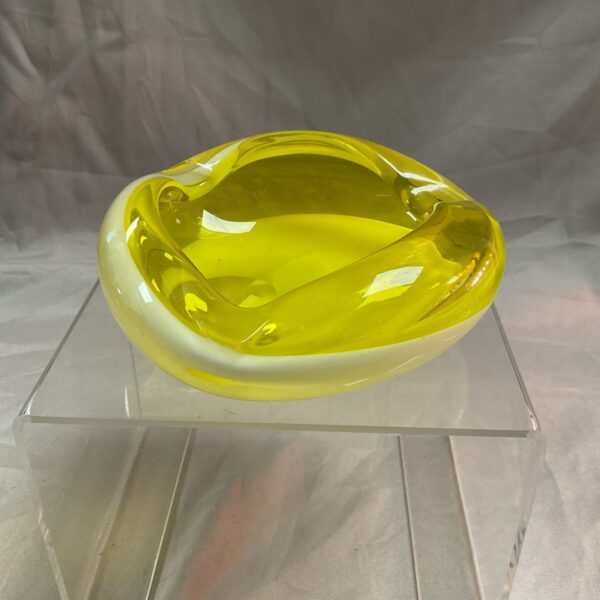 Vibrant vintage yellow glass bowl, mid-century modern style.