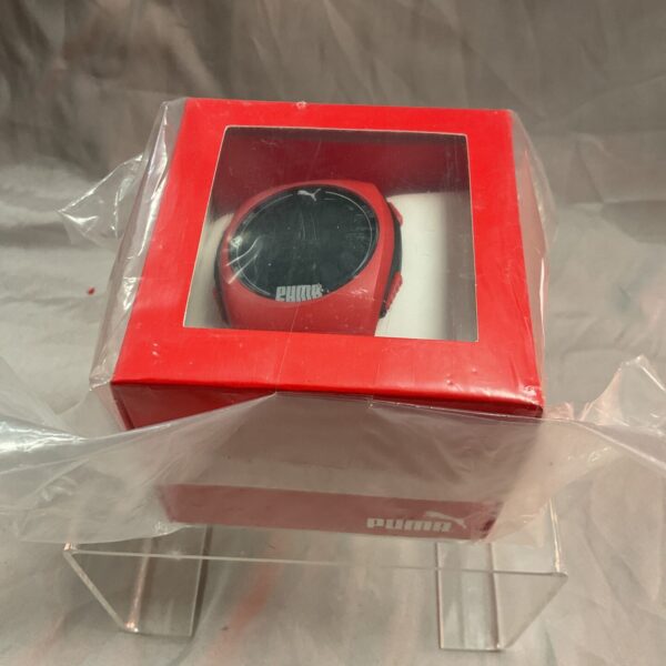 New black Puma sports watch with digital display.