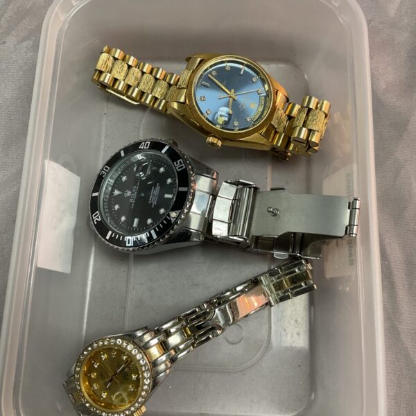 Gold-tone vintage wristwatch with crystal detailing.