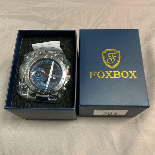 Front view of a Fox Box digital watch with a black strap.