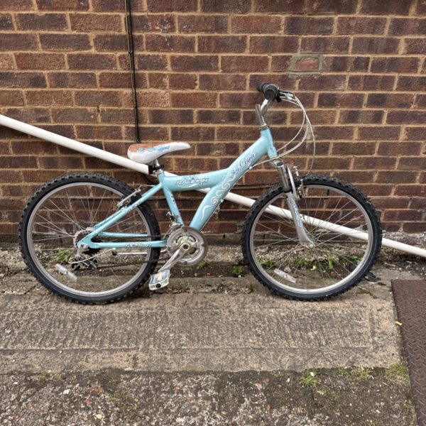 Light blue Raleigh Diva girls bicycle, side view.