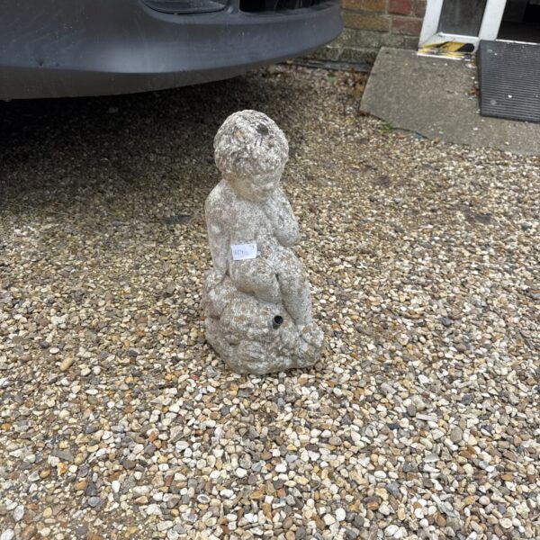 Small concrete garden boy statue for outdoor display.