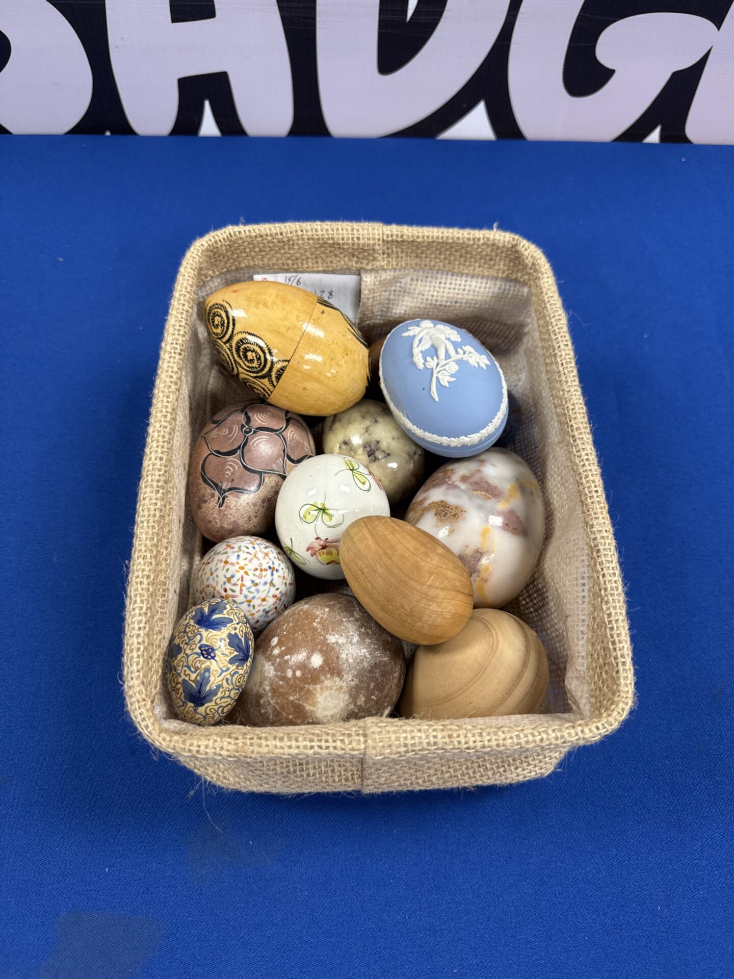 263 Small canvas tray of wooden & ceramic eggs inc one Wedgwood