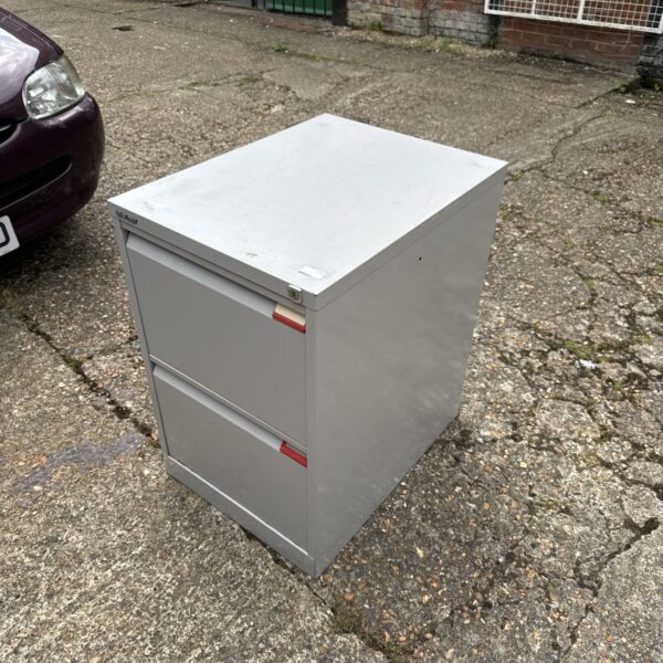 Silver Bisley filing cabinet in an outdoor setting.