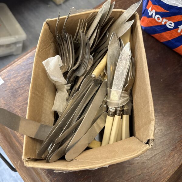 Vintage silver plated cutlery lot with forks and knives.
