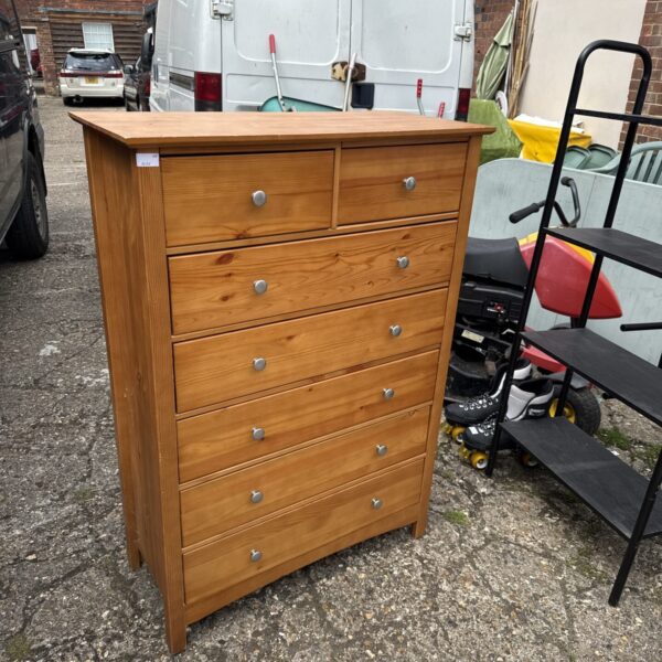 Vintage pine tallboy chest of drawers with five drawers.