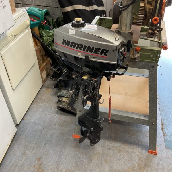 Vintage Mariner outboard motor for small boats and restoration projects.