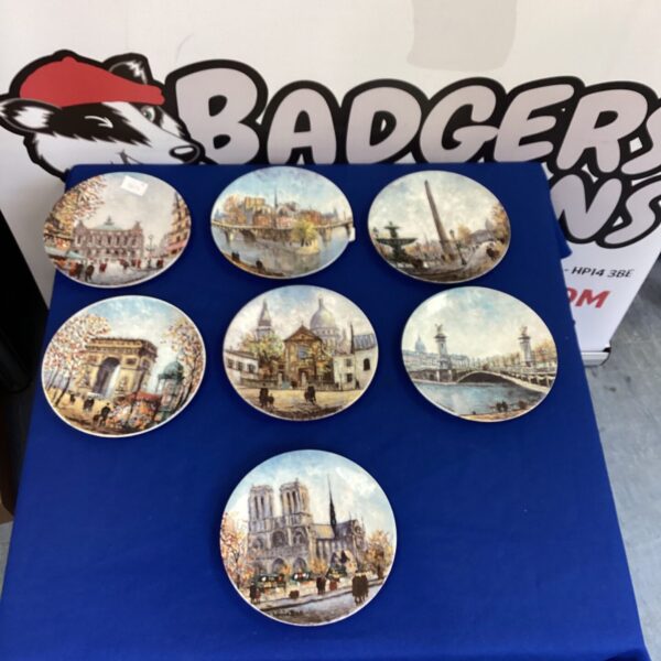 Collection of vintage French landmark plates for collectors.