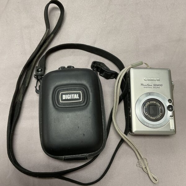 Canon PowerShot SD600 digital camera with wrist strap.