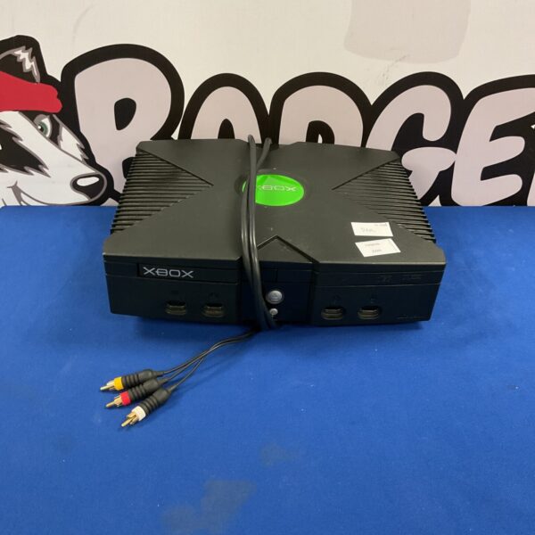 Microsoft Xbox console with cable for retro gaming.