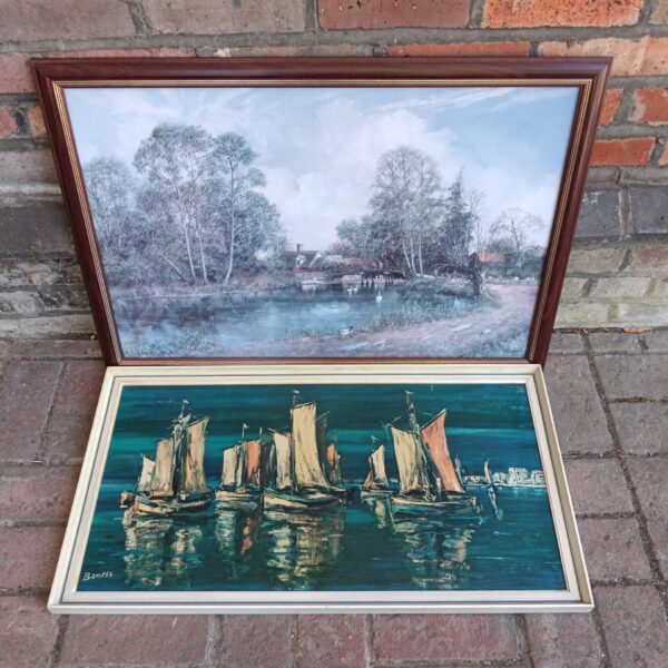Framed Boness sailboat print depicting a coastal scene.