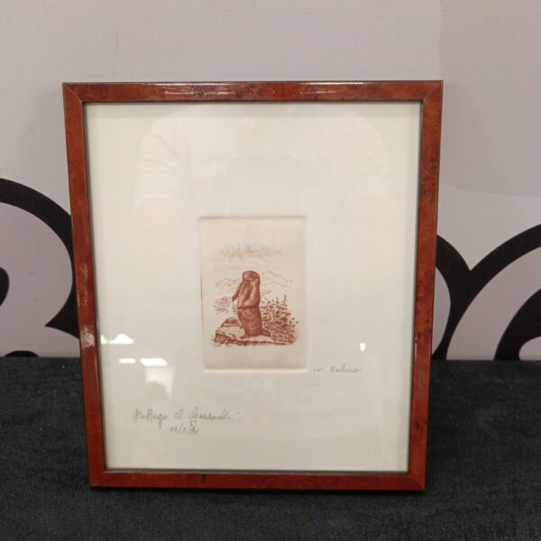 Vintage woodblock print of a beaver in a frame.