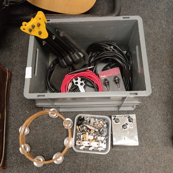 Music equipment lot featuring a tambourine and OD-8 guitar pedal.