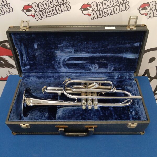 Vintage Rose Hill trumpet in a worn travel case.
