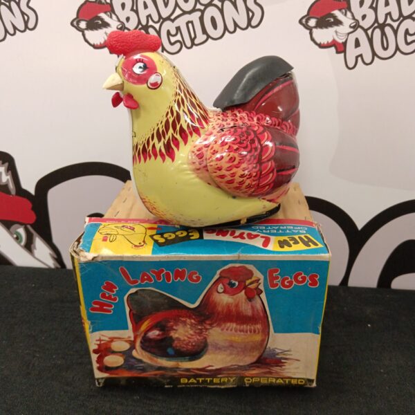 Vintage tin plate hen toy in original box, collectible.