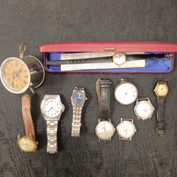 Group of vintage wristwatches and a pocket watch for collectors.