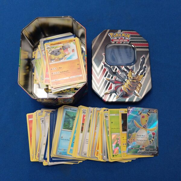 Pokémon card tin with holographic cards inside, collectible trading cards.