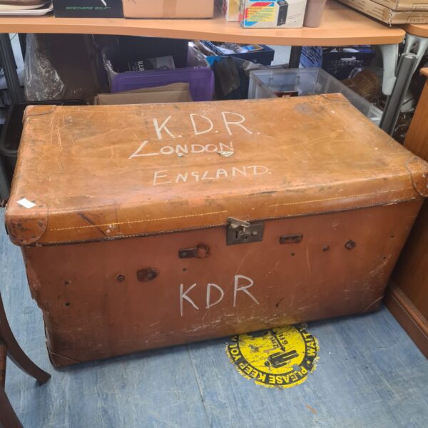 Antique steamer trunk with KDR marking, vintage travel luggage.