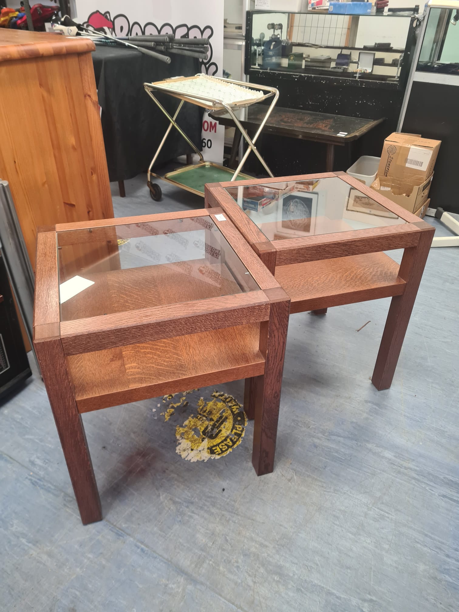 392 Two glass topped oak coffee tables