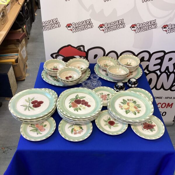 Vintage handpainted dinner service with floral design and candle holders.