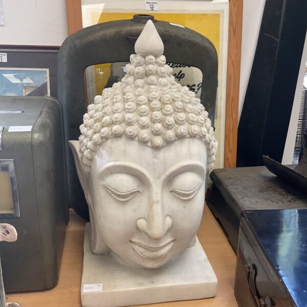 Large resin Buddha head sculpture for home decor.