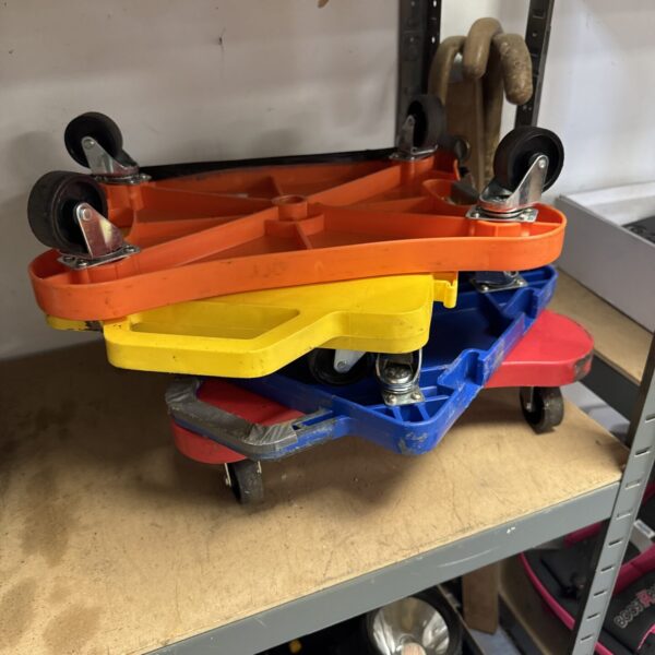Lot of four heavy-duty dollies for moving furniture.