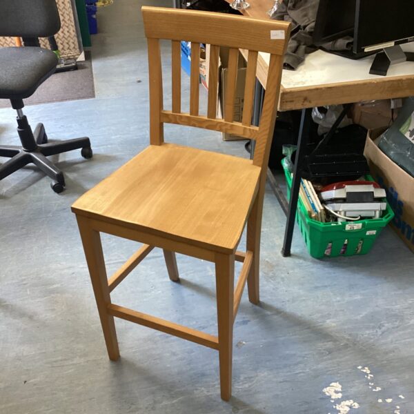 Rustic pine bar stool for kitchen island seating.