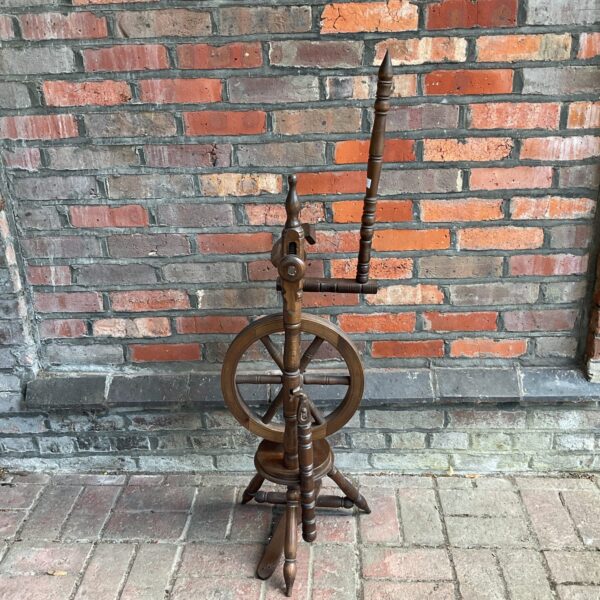 Vintage mahogany spinning wheel for wool and fibre crafts.