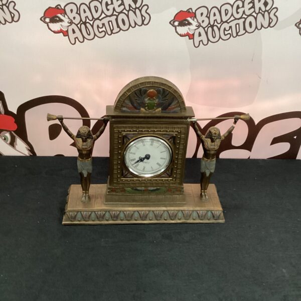 Detailed Egyptian quartz mantel clock with sculpted figures.