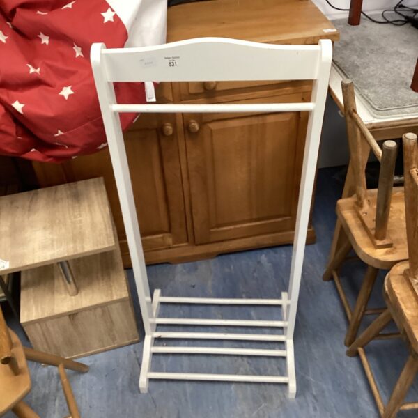 Vintage wooden clothes rack for laundry drying.