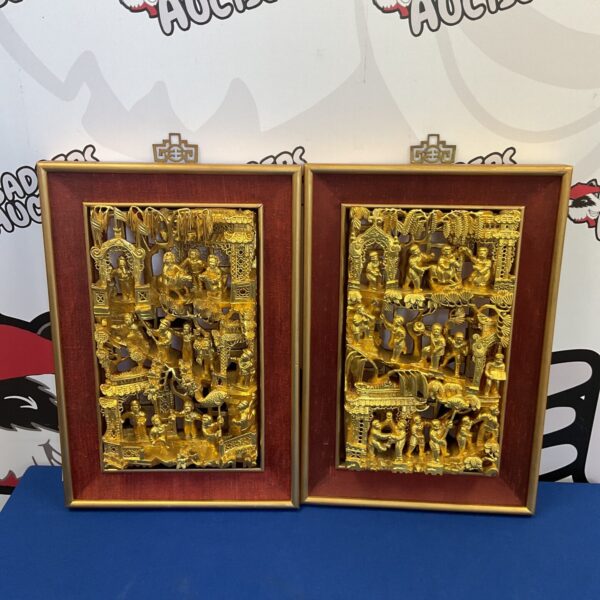 Vintage Chinese carved panels with gilded detailing and traditional motifs.