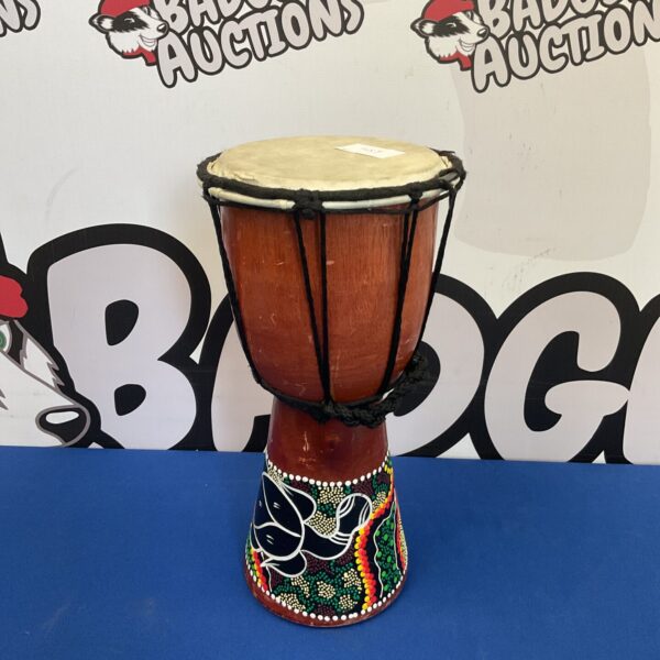 Colourful Aboriginal bongo drum with traditional dot painting artwork.