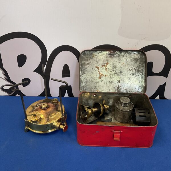 Vintage Thermidor stove in original red tin case, collectible camping equipment.