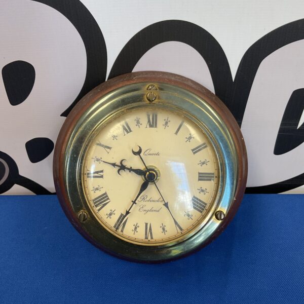 Vintage Robinclox quartz ships wall clock with Roman numerals.