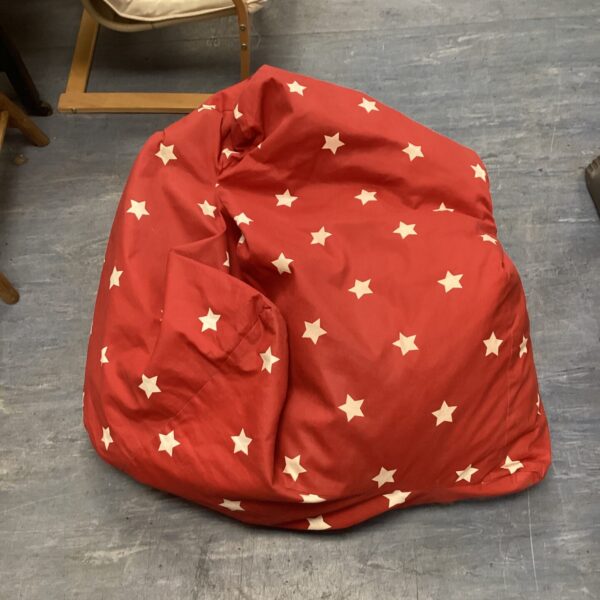 Red bean bag chair with star pattern for casual seating.