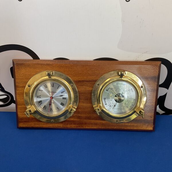 Vintage Spectrum ships porthole barometer with temperature and weather prediction.