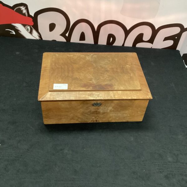 Vintage wooden cigar box with a hinged lid.