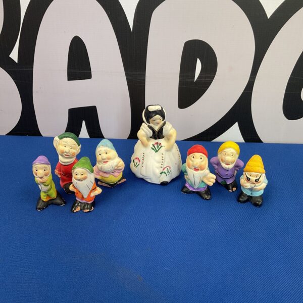 Vintage terracotta Snow White and the Seven Dwarfs figures, collectible Disneyana.