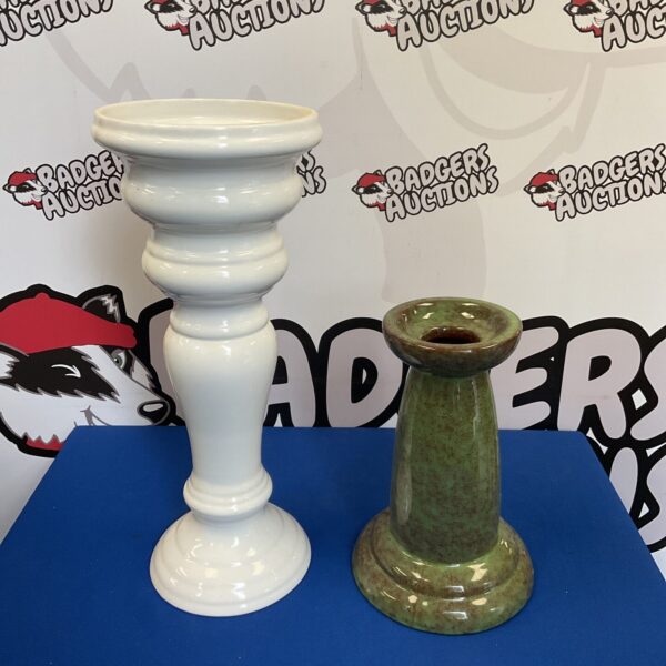 Vintage ceramic jardiniere stand for plant display.