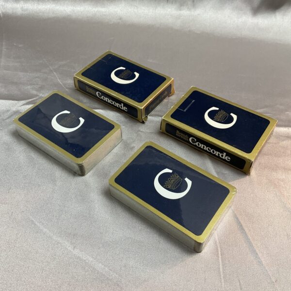 Sealed packs of vintage Concorde playing cards for collectors.