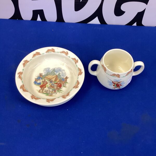 Vintage Royal Doulton Bunnykins bowl and cup set with bunny illustrations.