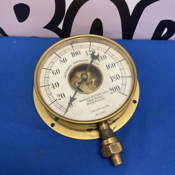 Vintage Mather & Platt pressure gauge with dial markings.