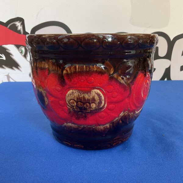 Vintage West German Fat Lava planter with orange and brown glaze.
